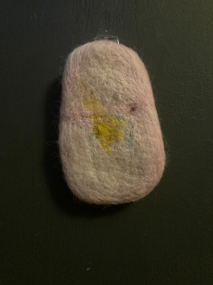 An oval shaped piece that looks like bruised flesh.